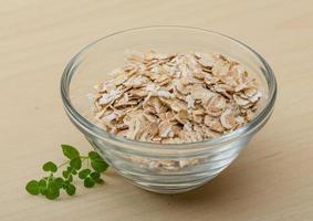 Dry oats on wood photo