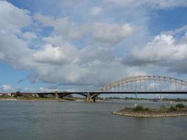 The city of Nijmegen at the river waal in the netherlands photo