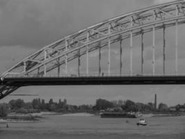 The city of Nijmegen at the river waal in the netherlands photo