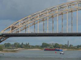 The city of Nijmegen at the river waal in the netherlands photo