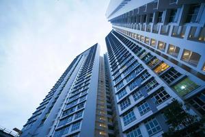 low angle view of signapore residential buildings against blue sky photo