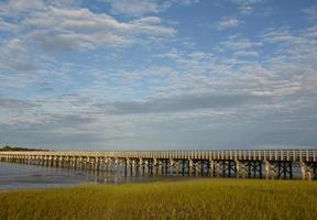 Long Wooden Bridge Stretching Over Duxbury Bay photo