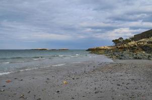 Sand Beach with Small Stones in Cohasset Massachusetts photo