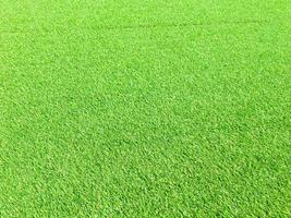 Artificial green lawn backyard for background. Texture for design photo