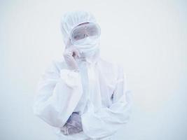 Portrait of confident asian male doctor or scientist in PPE suite uniform empty space deep thinking creative person hand on chin with looking ahead on white background. COVID-19 concept. photo