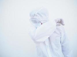 Asian male doctor or scientist in PPE suite uniform showing that feeling strees and sad. coronavirus or COVID-19 concept isolated white background photo