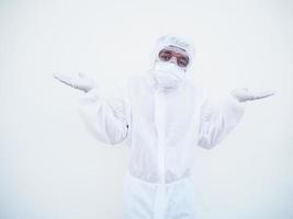 Positive young doctor or scientist in PPE suite uniform showing both hands open palms with copy space. coronavirus or COVID-19 concept isolated white background photo