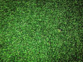 Artificial green lawn backyard for background. Texture for design photo
