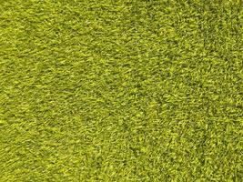 Artificial green lawn backyard for background. Texture for design photo