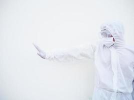 Asian doctor or scientist in PPE suite uniform showing stop sign with his arms to stop doing something while looking ahead.  gesturing stop, warning of danger.  isolated white background photo