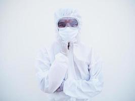 Portrait of confident asian male doctor or scientist in PPE suite uniform empty space deep thinking creative person hand on chin with looking ahead on white background. COVID-19 concept. photo