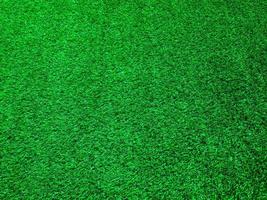 Artificial green lawn backyard for background. Texture for design photo