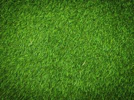 Modern green lawn texture background. Wallpaper for work and design. photo