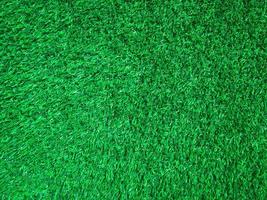 Artificial green lawn backyard for background. Texture for design photo