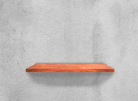 Wood shelves on concrete wall texture background with clipping path. Top view photo