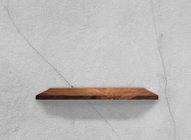 Wood shelves on concrete wall texture background with clipping path. Top view photo
