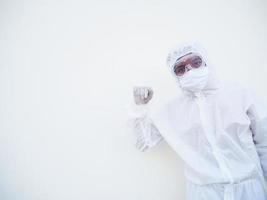 Confident asian male doctor or scientist in PPE suite uniform standing at looking ahead with copy space for text or design in the white background. coronavirus or COVID-19 concept. photo