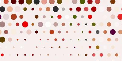 Light orange vector background with spots.