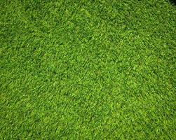 Artificial green lawn backyard for background. Texture for design photo