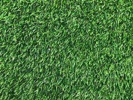 Modern green lawn texture background. Wallpaper for work and design. photo