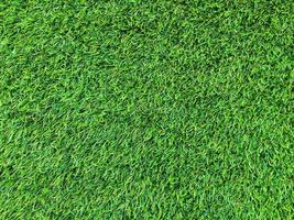 Modern green lawn texture background. Wallpaper for work and design. photo