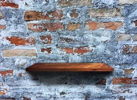 Rustic wooden shelf on grey concrete wall texture background with clipping path. pattern wallpaper photo