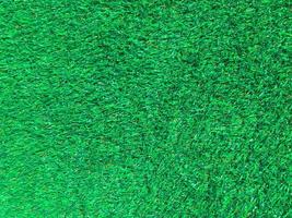 Artificial green lawn backyard for background. Texture for design photo