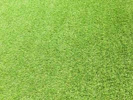 Artificial green lawn backyard for background. Texture for design photo