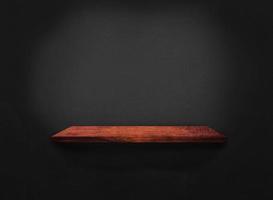 Blank of old wooden shelf on dark wall texture background with clipping path for design photo