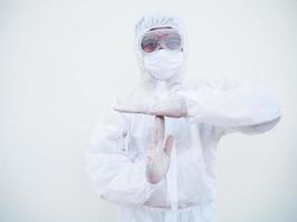 Asian doctor or scientist in PPE suite uniform showing time out gesture by hands sign while standing and looking forward. coronavirus or COVID-19 concept isolated white background photo