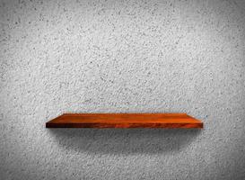 Top view of wood shelves on concrete wall texture background with clipping path for design photo