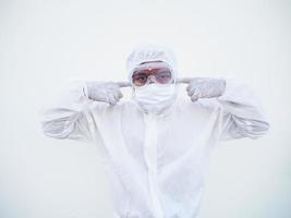 Asian doctor or scientist in PPE suite uniform covers ears with hands. Danger of coronavirus or COVID-19 concept isolated white background photo