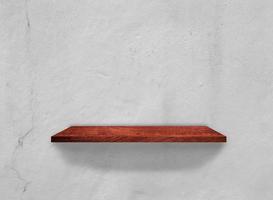 Wood shelves on concrete wall texture background with clipping path. Top view photo