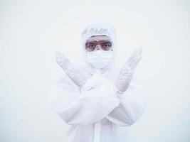 Asian doctor or scientist in PPE suite uniform showing x sign with his arms to stop doing something while looking ahead.  gesturing stop, warning of danger. isolated white background photo