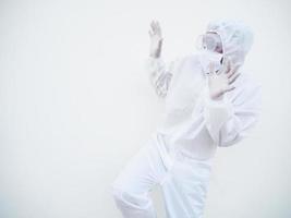 Asian doctor or scientist in PPE suite uniform showing has frightened expression as notices something terrible or scarying for text or design on a white background. coronavirus or COVID-19 concept photo