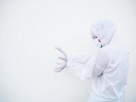 Asian doctor or scientist in PPE suite uniform showing unleash the power by hand with copy space on a white background. coronavirus or COVID-19 concept photo