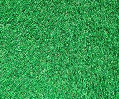 Artificial green lawn backyard for background. Texture for design photo