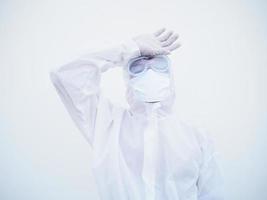 Asian male doctor or scientist in PPE suite uniform showing that feeling strees and headache. coronavirus or COVID-19 concept isolated white background photo