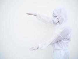 Asian doctor or scientist in PPE suite uniform showing holding something on hands for text or design on a white background. coronavirus or COVID-19 concept photo