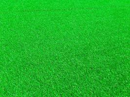 Artificial green lawn backyard for background. Texture for design photo