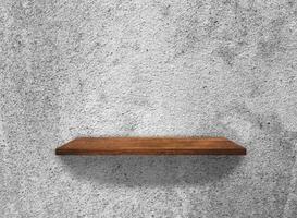 Wood shelves on concrete wall texture background with clipping path. Top view photo