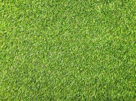 Modern green lawn texture background. Wallpaper for work and design. photo