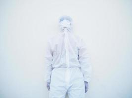 Asian male doctor or scientist in PPE suite uniform with wearing face mask protective. The mood is like sad and calm, coronavirus or COVID-19 concept isolated white background photo