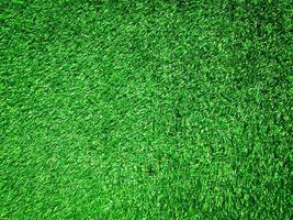 Artificial green lawn backyard for background. Texture for design photo