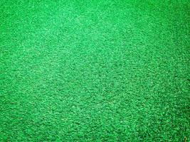 Artificial green lawn backyard for background. Texture for design photo