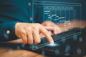 Man working with technology computer in Business Analytics and Data Management System to make report with KPI and metrics connected to database. Corporate strategy for operations, planing, marketing. photo