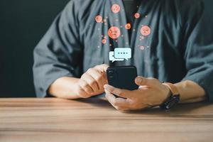 Man hand using smartphone typing live chat chatting on application communication digital web and social network concept. Social media application chat box. photo