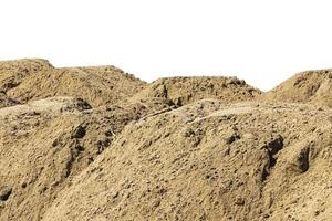 Construction site with heaps of sand. Pile of sand on an isolated white background. copy space. photo