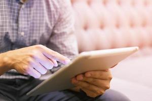 Young male hand touching, pressing modern button and hold laptop. Isolated on White. Business technology concept. photo
