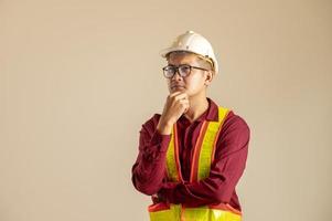Portrait of an Asian engineer studying a room plan civil engineer at construction site photo